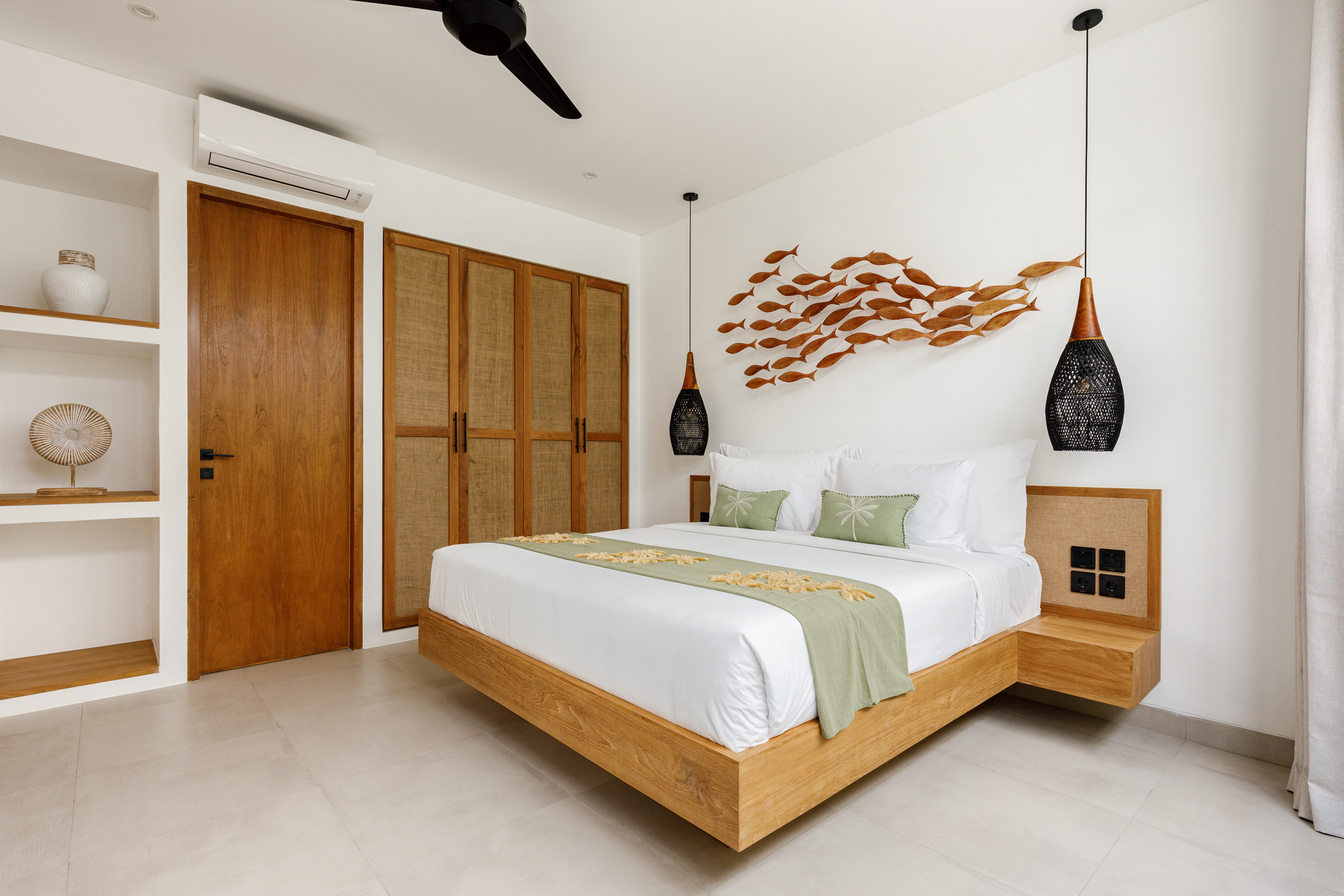 Modern white bedroom with wooden bed, wardrobe, pendant lights, and fish wall art