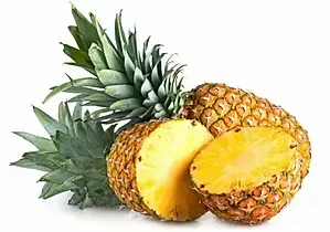 Fresh pineapple with two cut halves showing bright yellow flesh on a white background