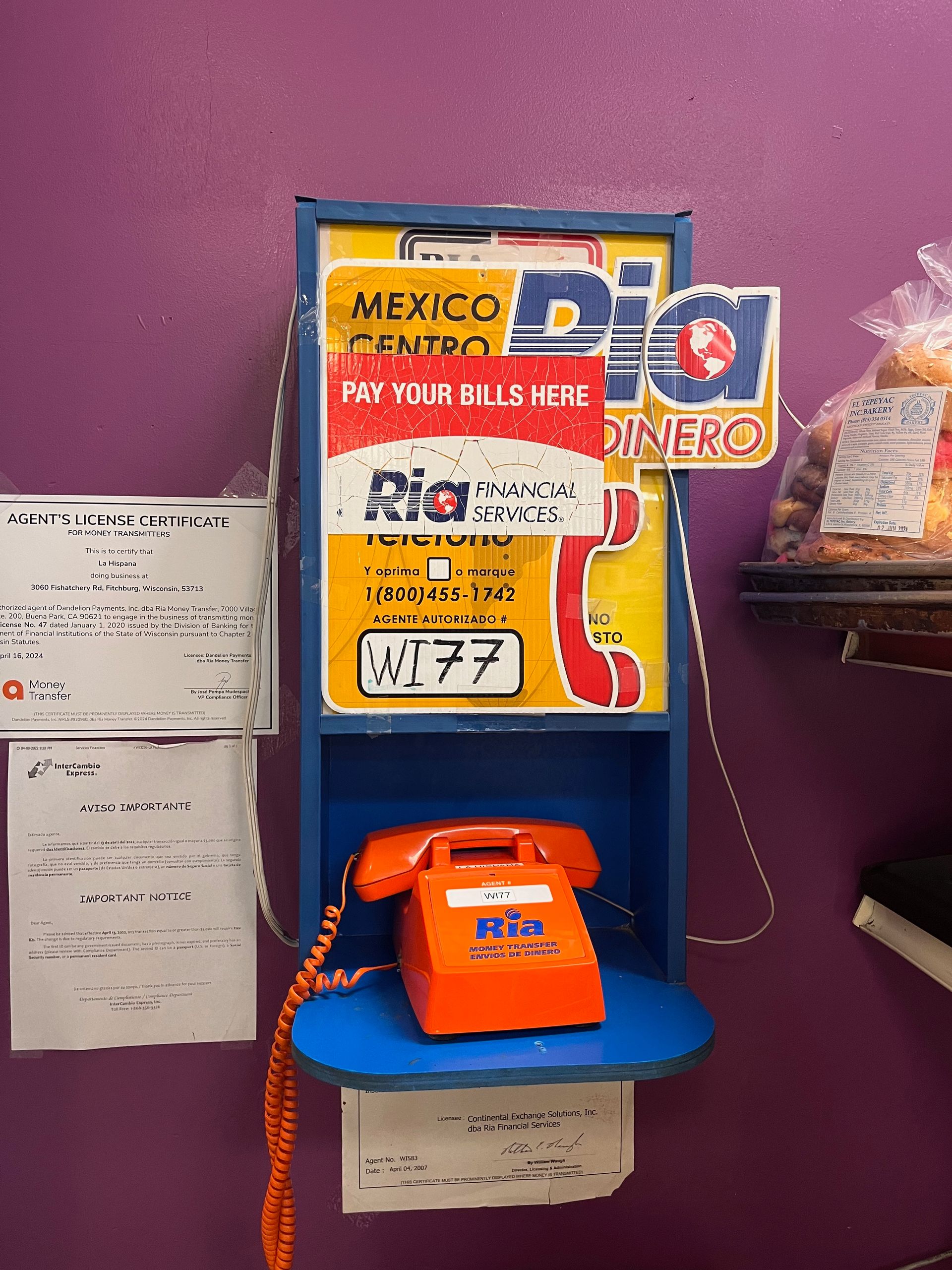 A pay phone with a sign that says dig on it