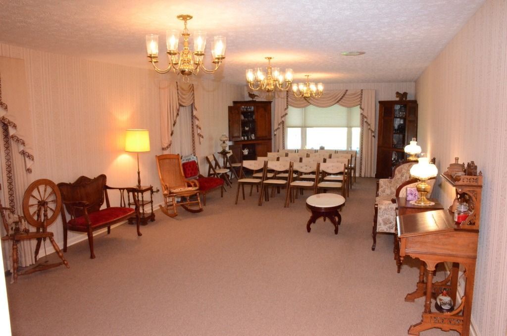 room with lots of seating and different sized chairs