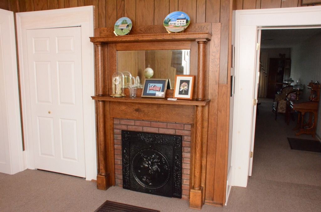 fireplace with photos on mantel 