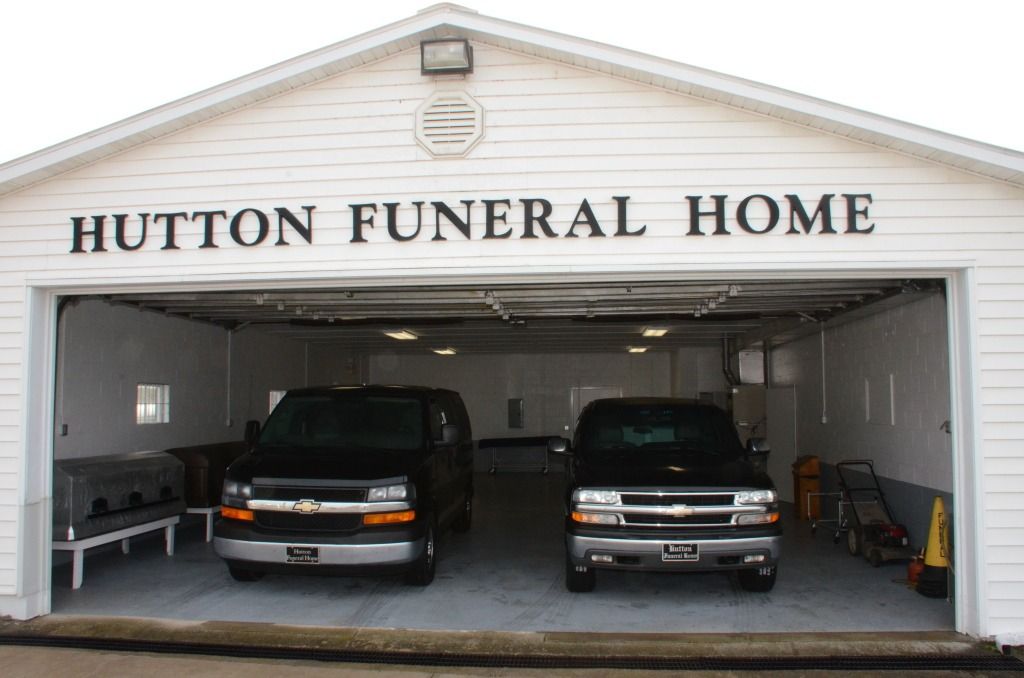 photo of the garage and two vehicles for the funeral home
