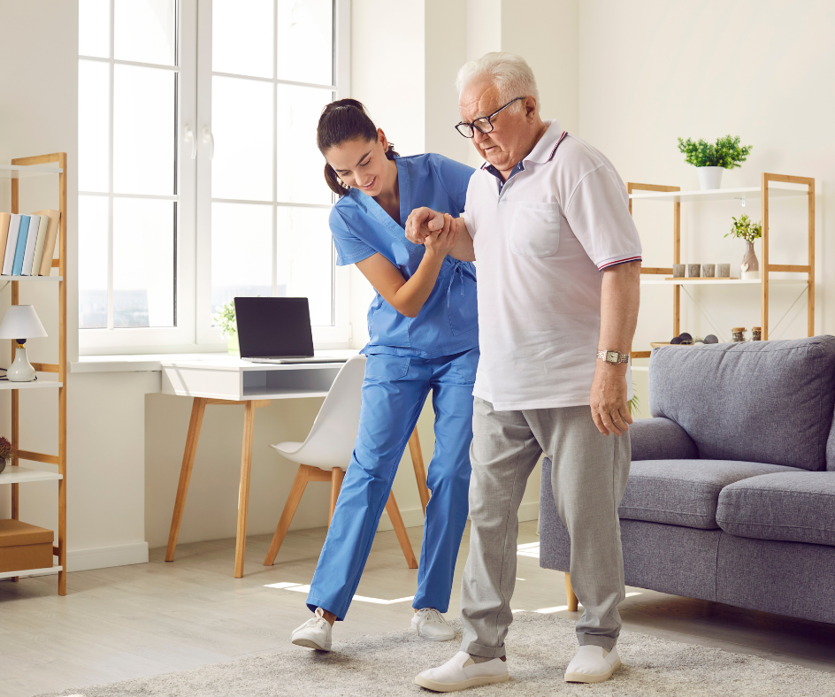 Caregiver helping an older person walk in a brightly lit room.