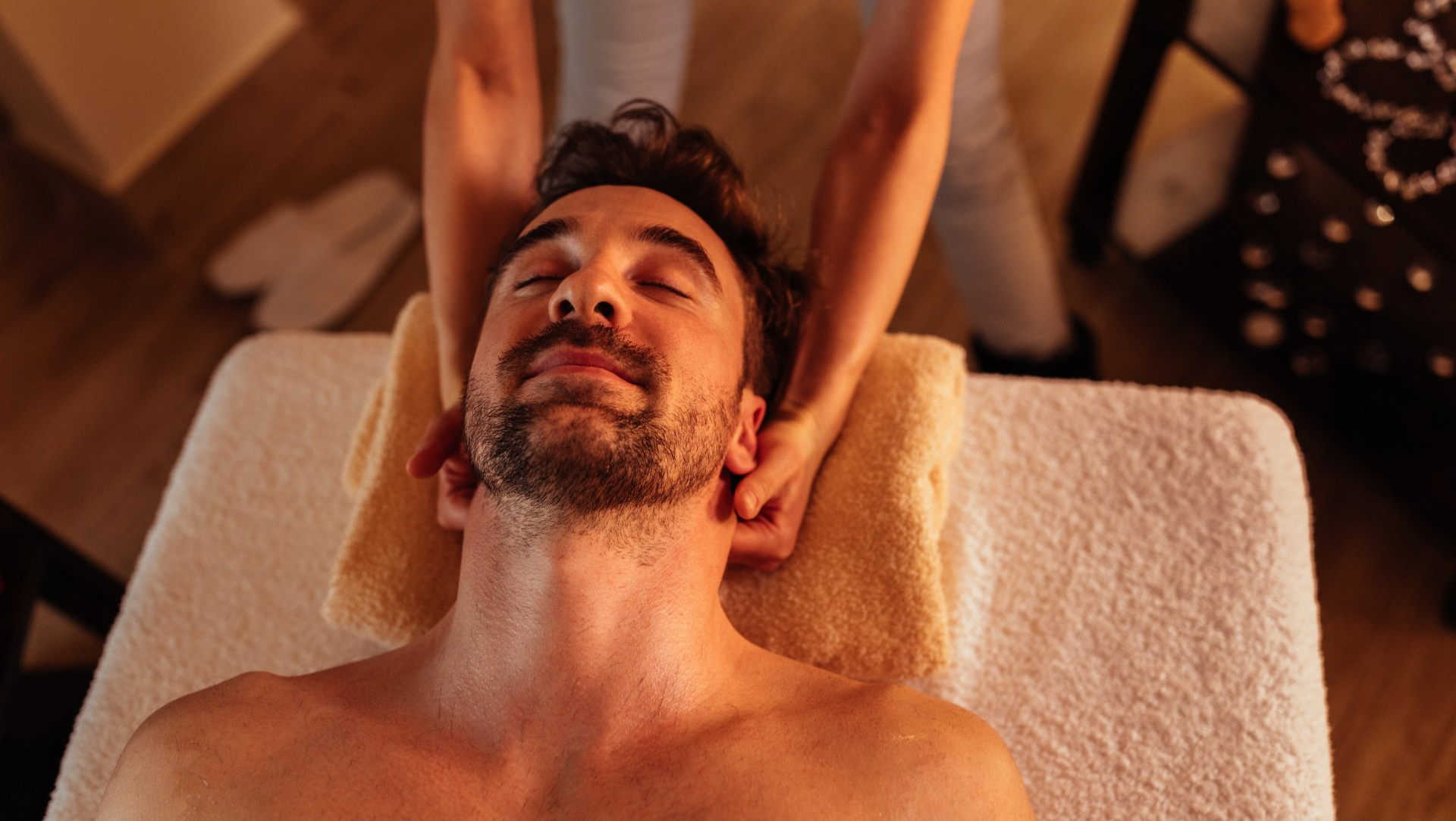 View looking down on man getting a neck massage