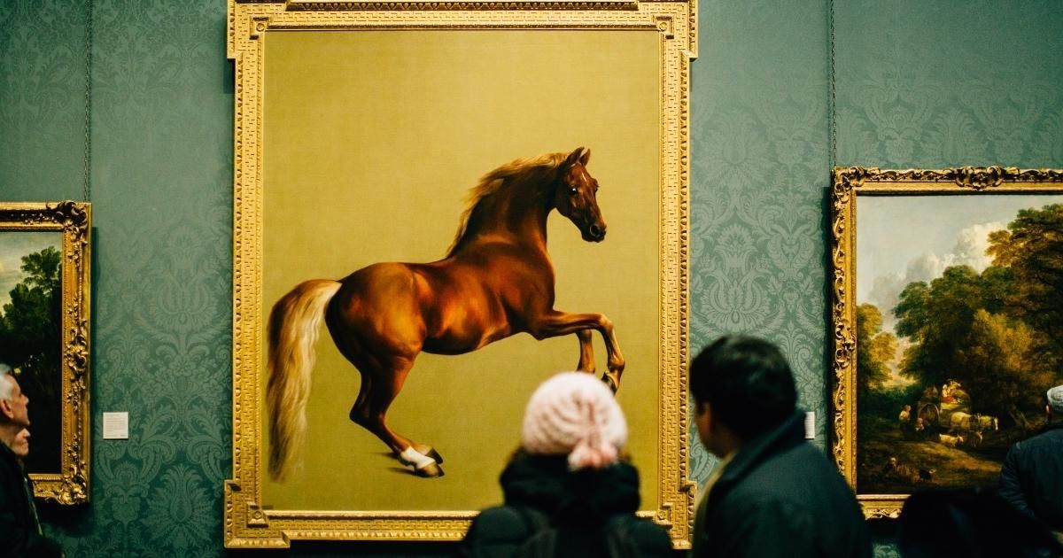 Horse painting in a gallery, with two visitors viewing it from below.