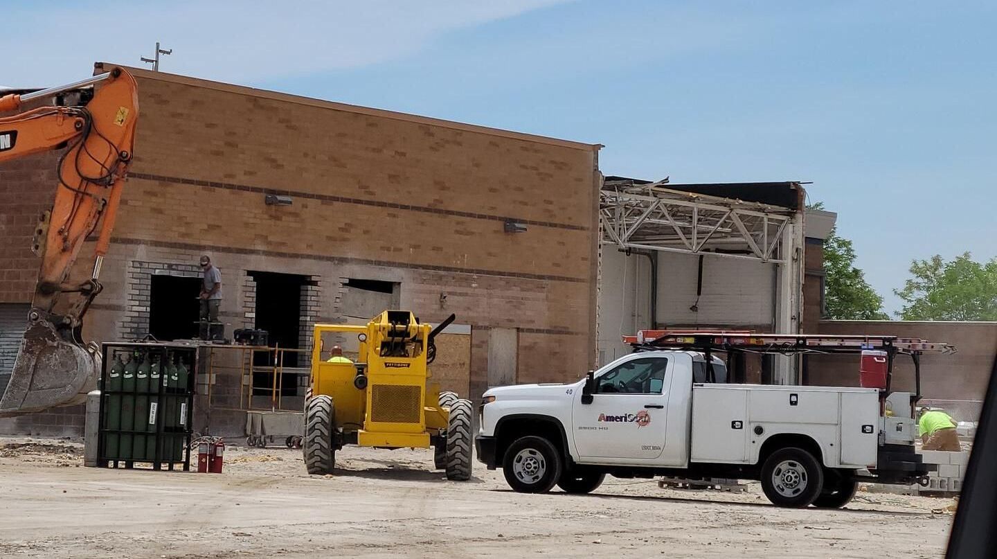 Bricklayers from Ameriseal work to seal up an old loading bay at Highland Park Business Development