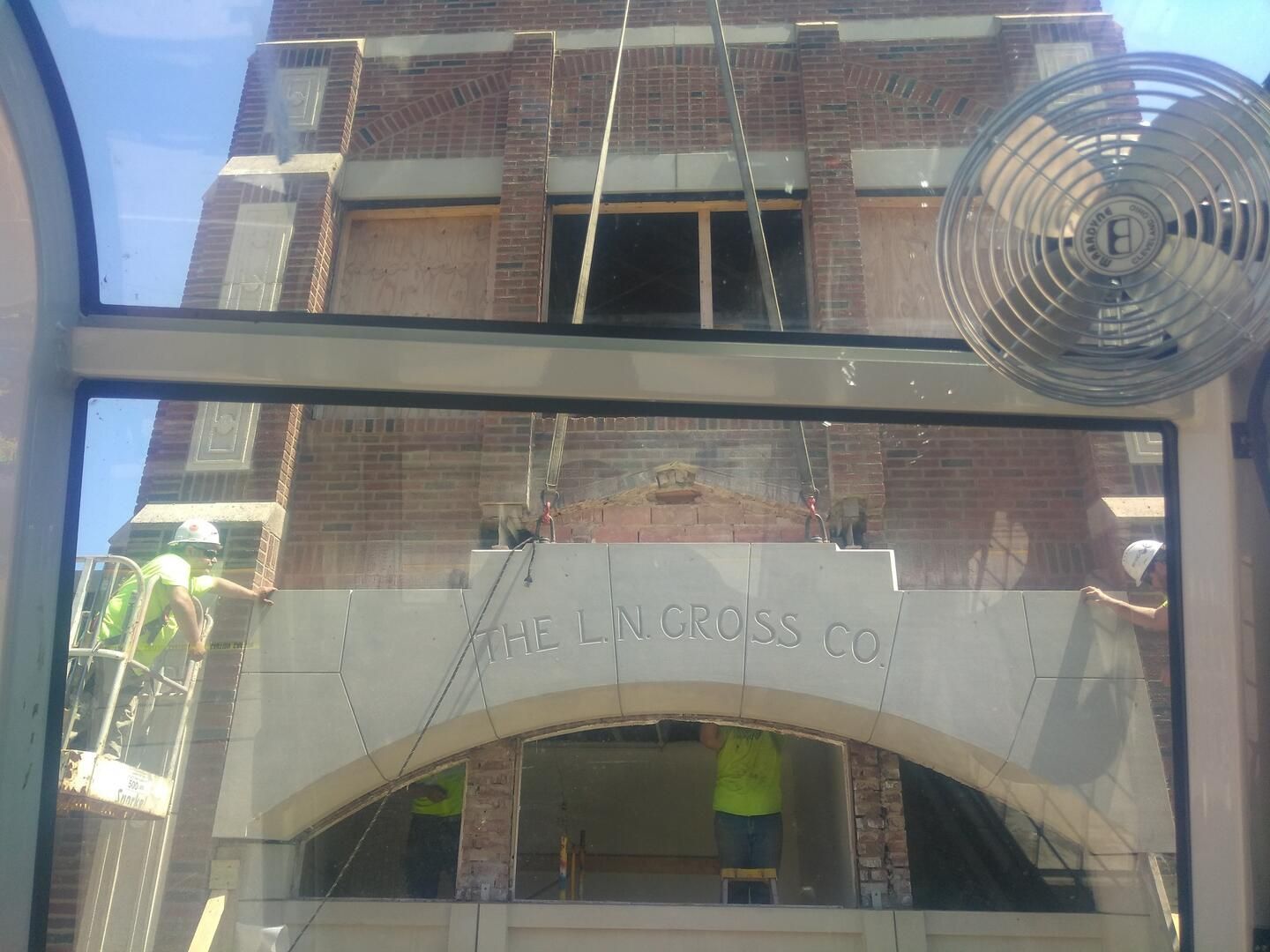 The crane places the Keystone of the L.N. Gross building in Kent
