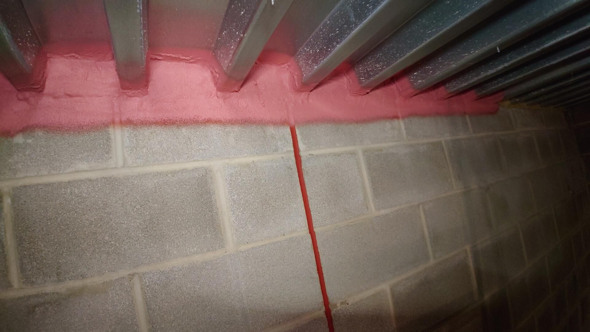The finished product!  This fireproof walls' through-penetrations are now sealed against gas, smoke, and heat.  Firestopping by Ameriseal! 