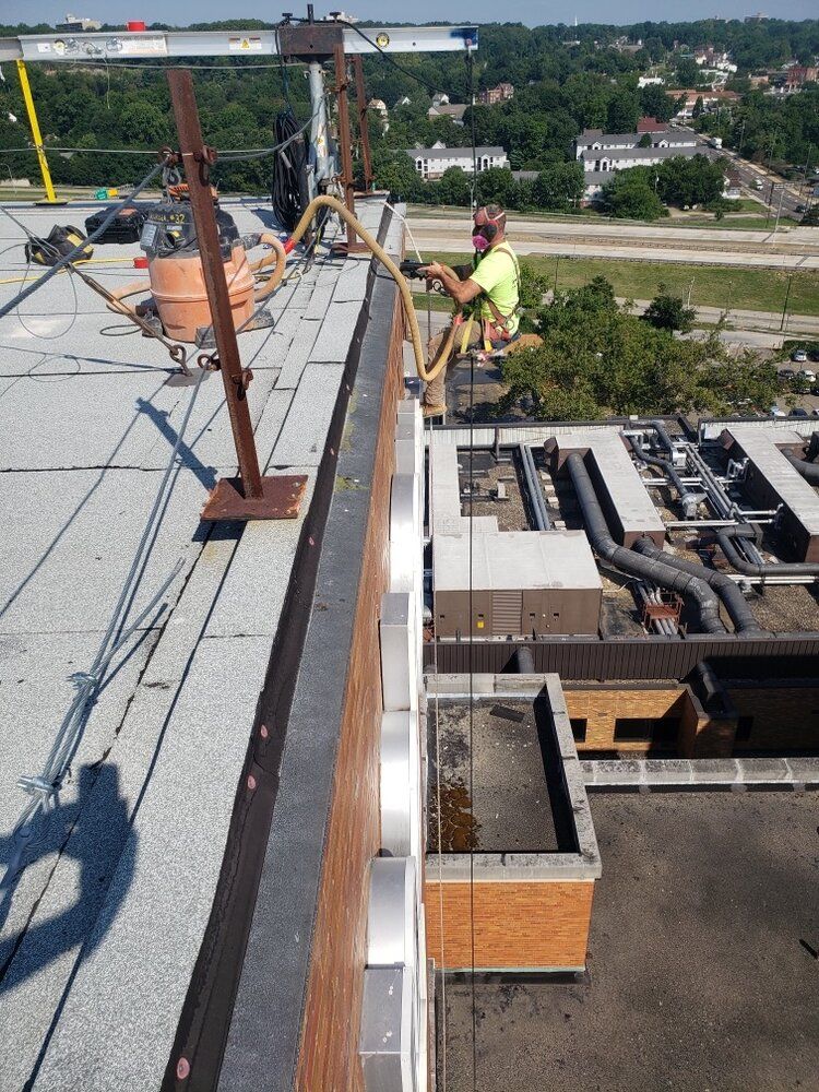 Ameriseal team repelling off of Akron General Hospital for a Tuckpoint