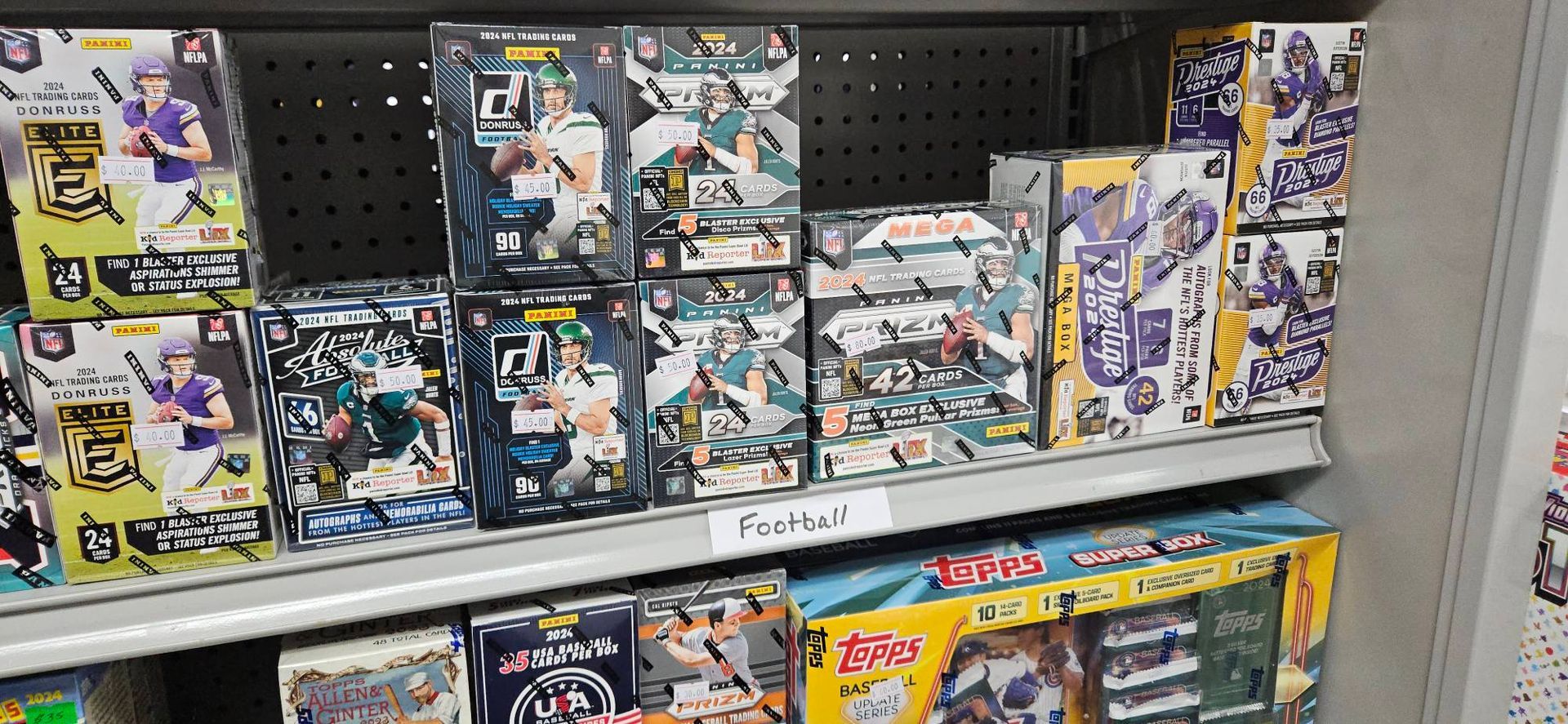 A shelf filled with a variety of toys and games.