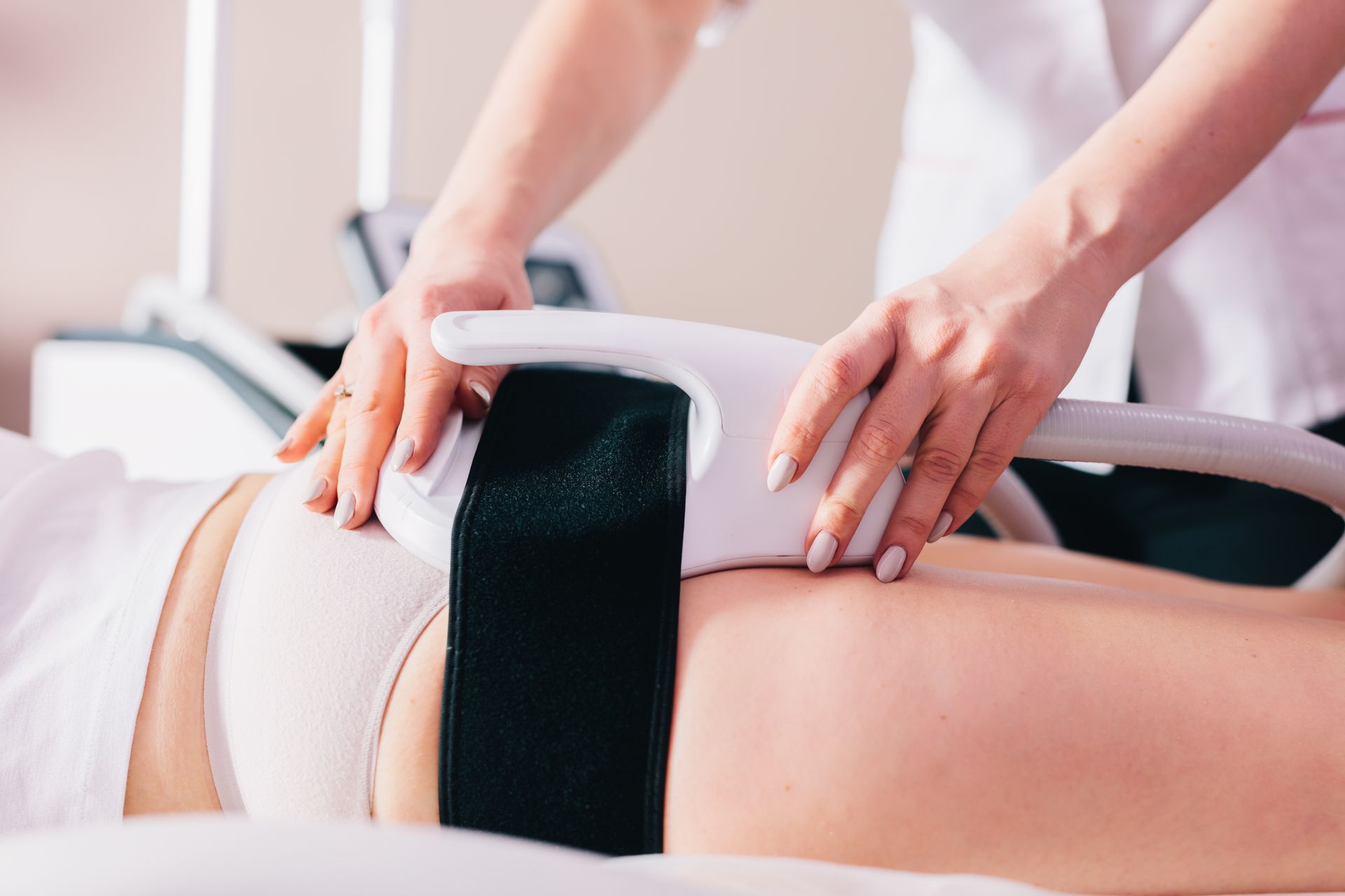 a woman is getting a massage on her leg with a wooden roller .