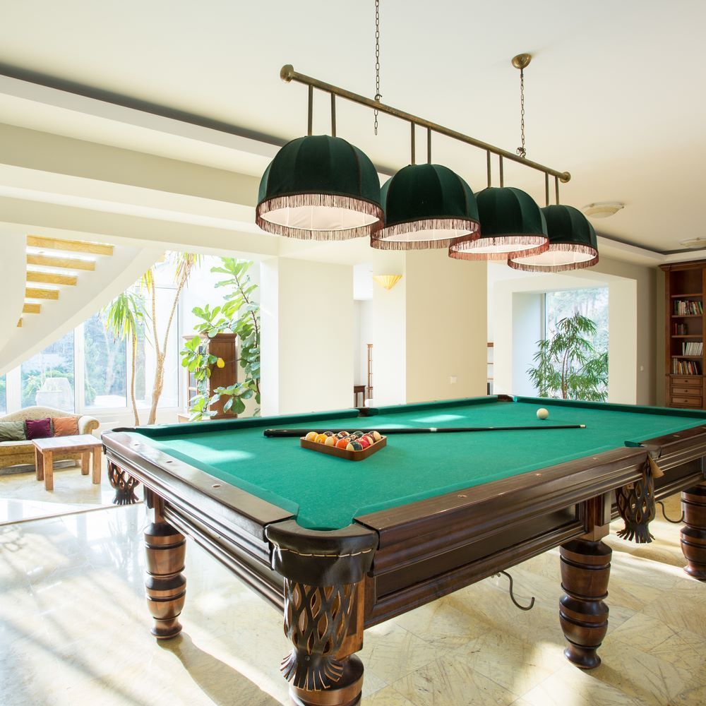 A Pool Table in a Living Room With a Lot of Windows — Bellarine Removals In Bendigo, VIC