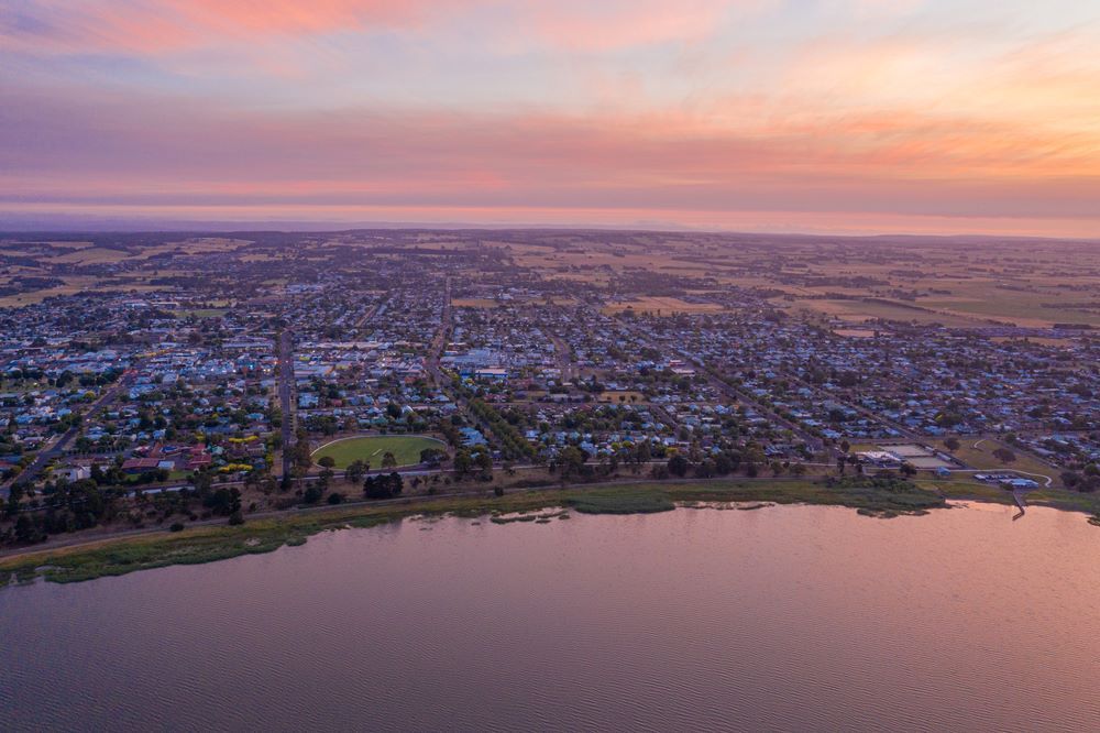 An Aerial View of a City and a Lake at Sunset — Bellarine Removals In Colac, VIC