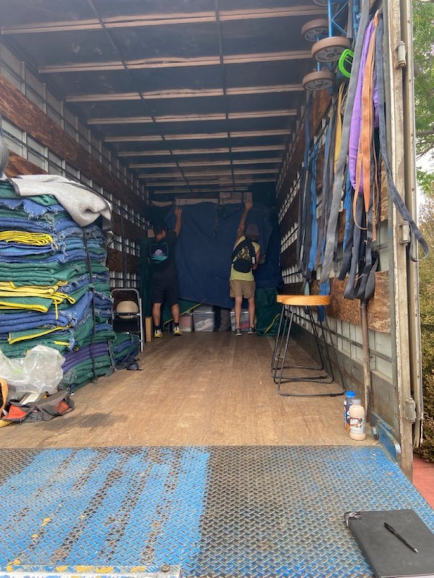 A Two Men Are Standing Inside of a Truck — Bellarine Removals In Geelong, VIC