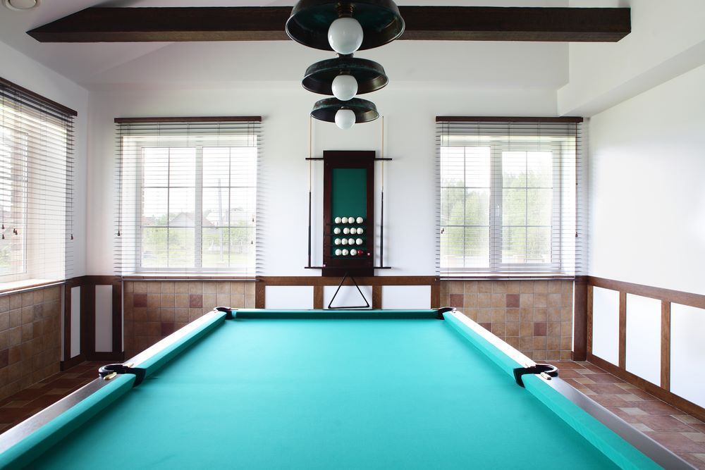 A Pool Table in a Room With a Lot of Windows — Bellarine Removals In Geelong, VIC