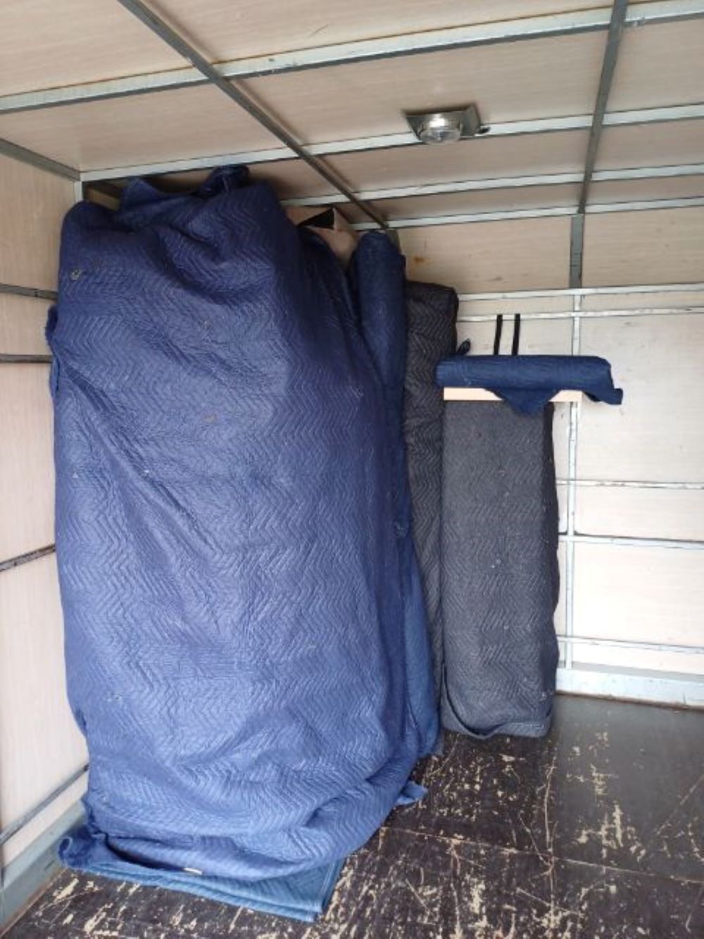 A Blue Blanket is Covering a Large Piece of Furniture — Bellarine Removals In Warrnambool, VIC