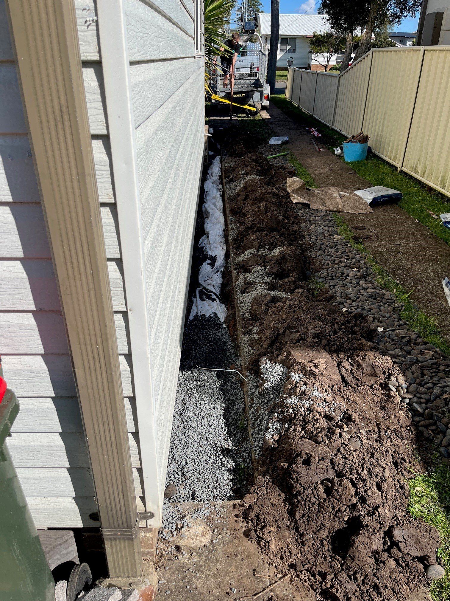 Male Plumber Fixing Water Meter With Adjustable Wrench — Distinct Plumbing Services In Flinders NSW