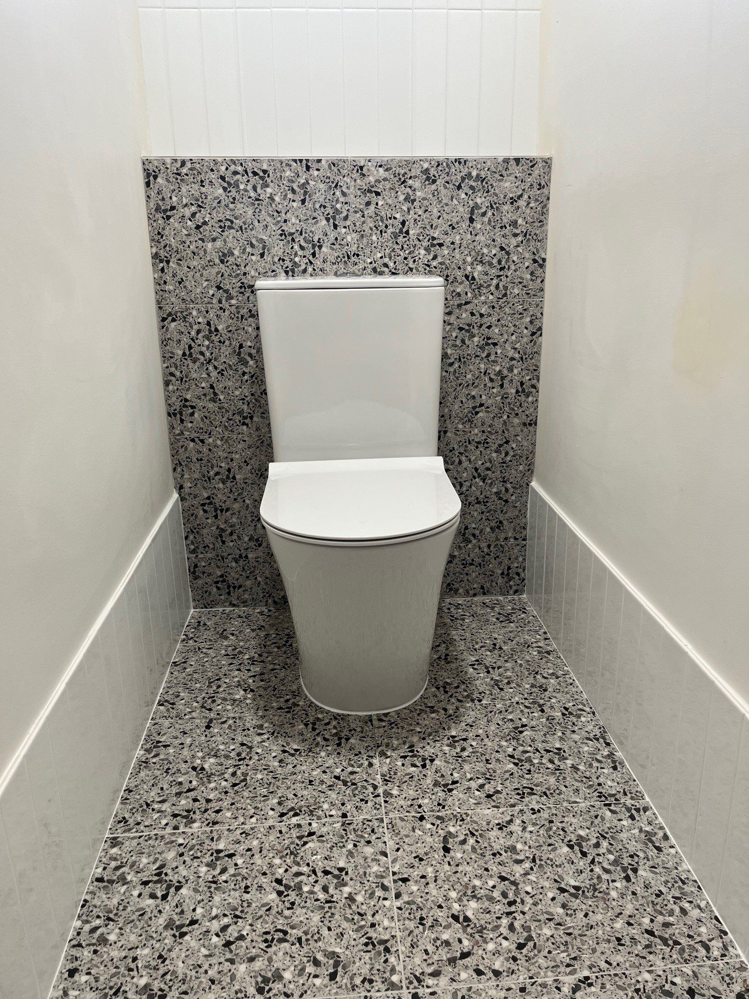 Plumber Repairing The Hot Water Heater — Distinct Plumbing Services In Flinders NSW