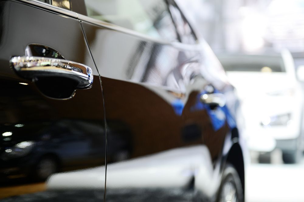A Close Up of the Door Handle of a Black Car — Camden Haven Panel Works In Laurieton, NSW