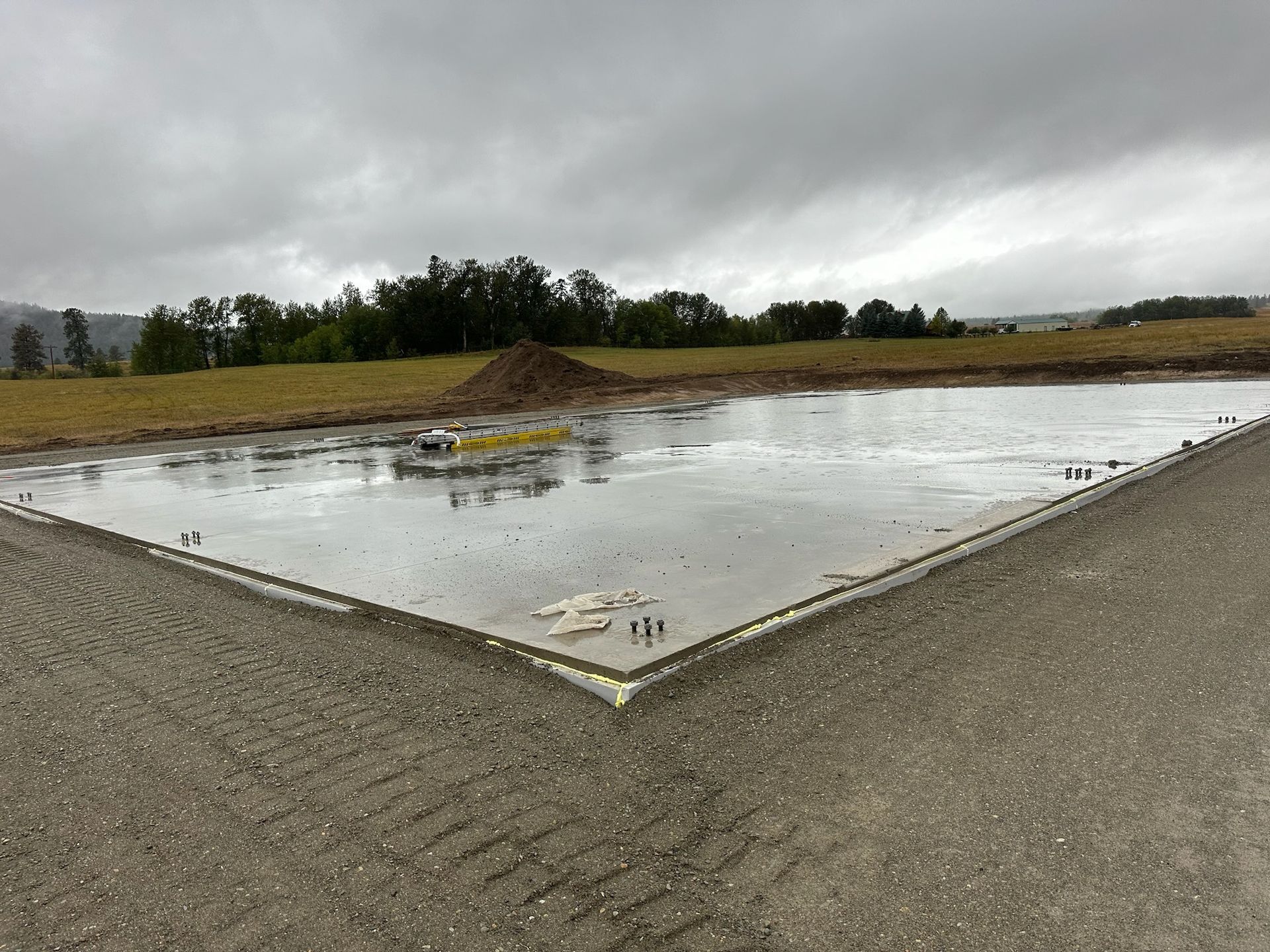 A large concrete slab is sitting on the side of a road.