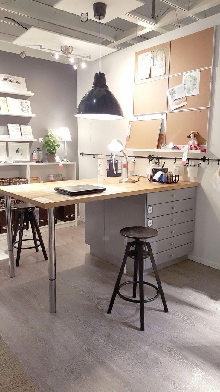 A room with a table and stools in it