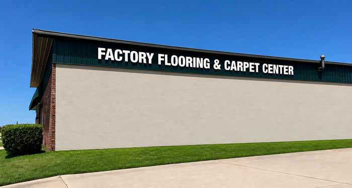 Carpet Center roadside sign with green and white lettering and a red “Free Estimates!” sign below.