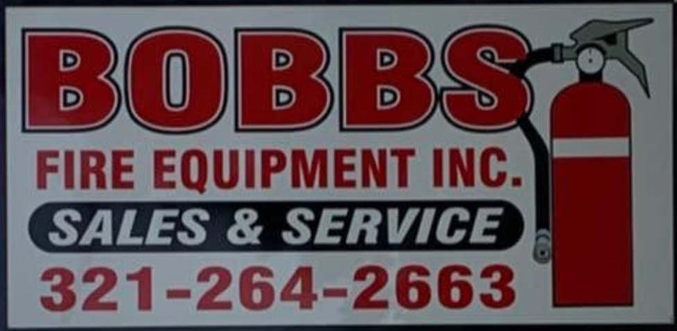 Robbs sign in front of a roadside business under a blue sky, with palm trees and a street visible.