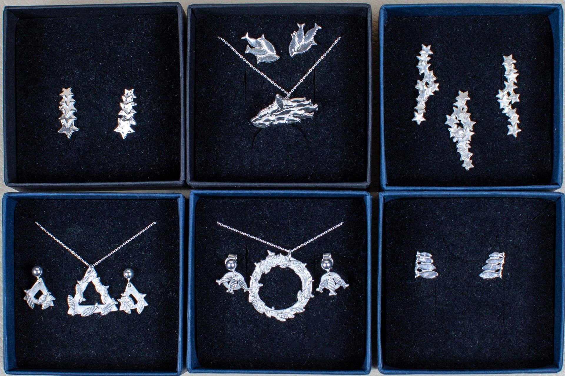 Six boxes of silver jewellry including necklaces and earrings