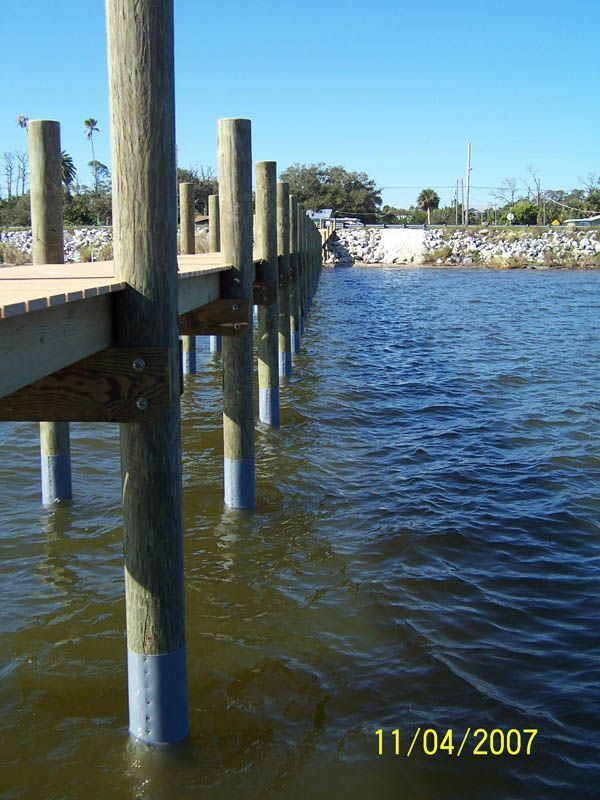 Dock Piling Wrapped In Polymer — Cocoa Beach, FL — Darrell’s Docks
