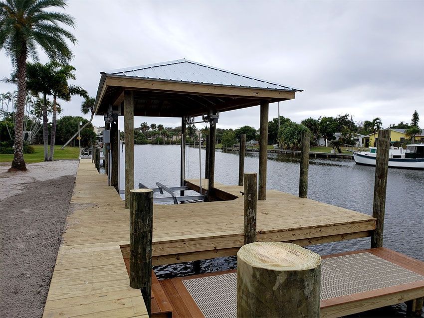 Boat Lift With Roof — Cocoa Beach, FL — Darrell’s Docks