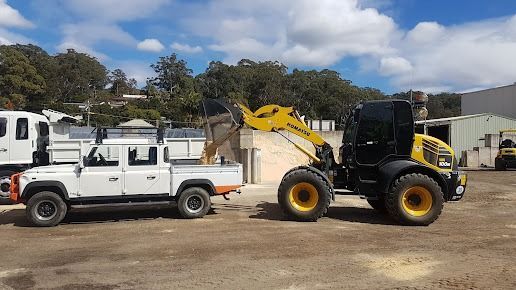 Dirt is Being Placed In A white truck — Ourimbah Landscape Supplies In Ourimbah, NSW