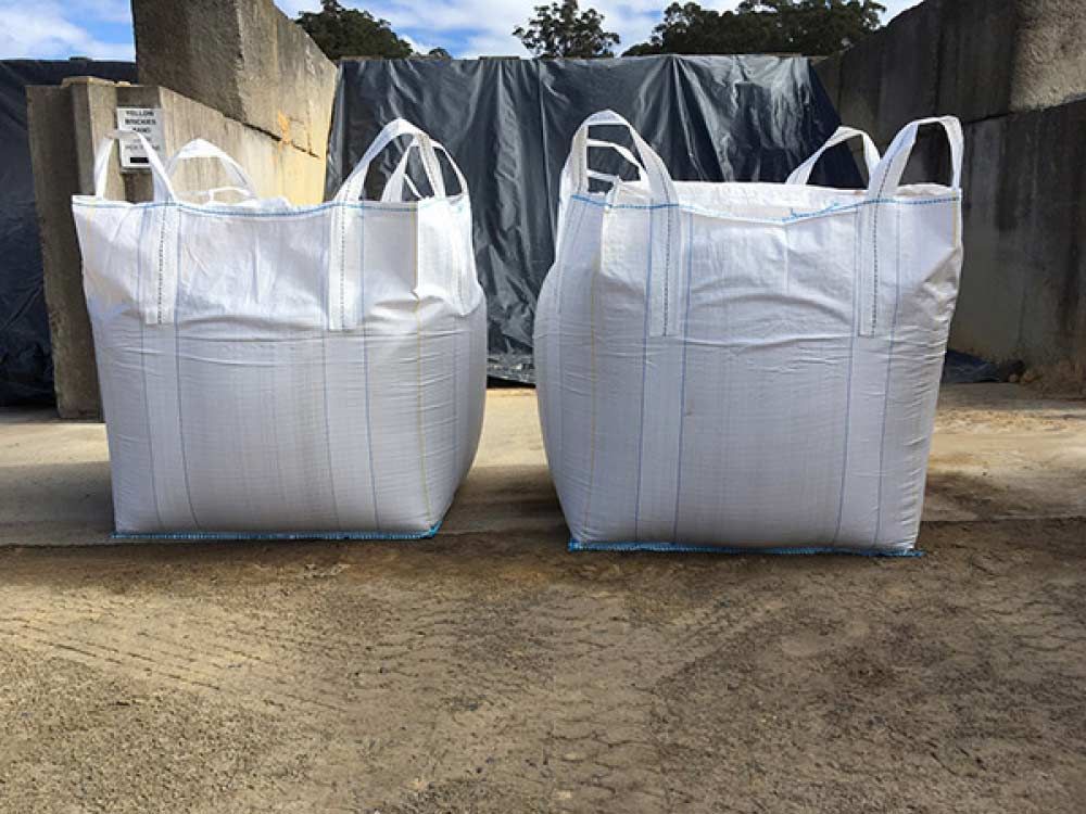 Two White Bags Are Sitting Next to Each Other — Ourimbah Landscape Supplies In Ourimbah, NSW