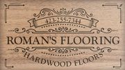 A logo for roman 's flooring hardwood floors