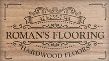 A logo for roman 's flooring hardwood floors