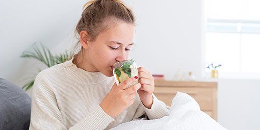 Woman Drinking Tea — Elko, MN — Treasured Birth LLC Woman Drinking Tea — Elko, MN — Treasured Birth LLC