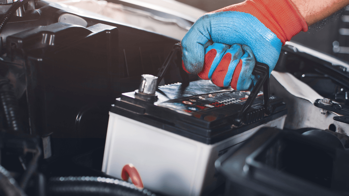 a mechanic changing a car battery
