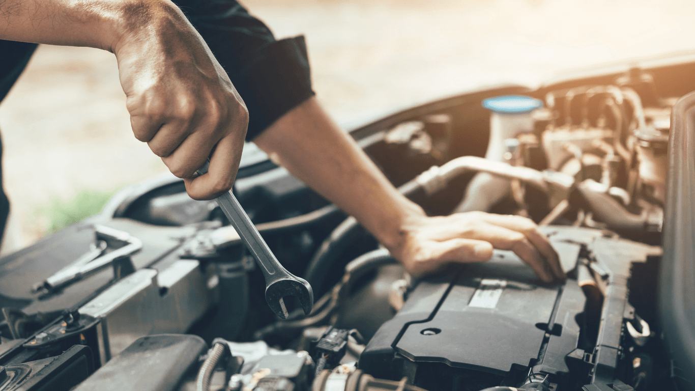 under the hood of a car auto repair outdoors
