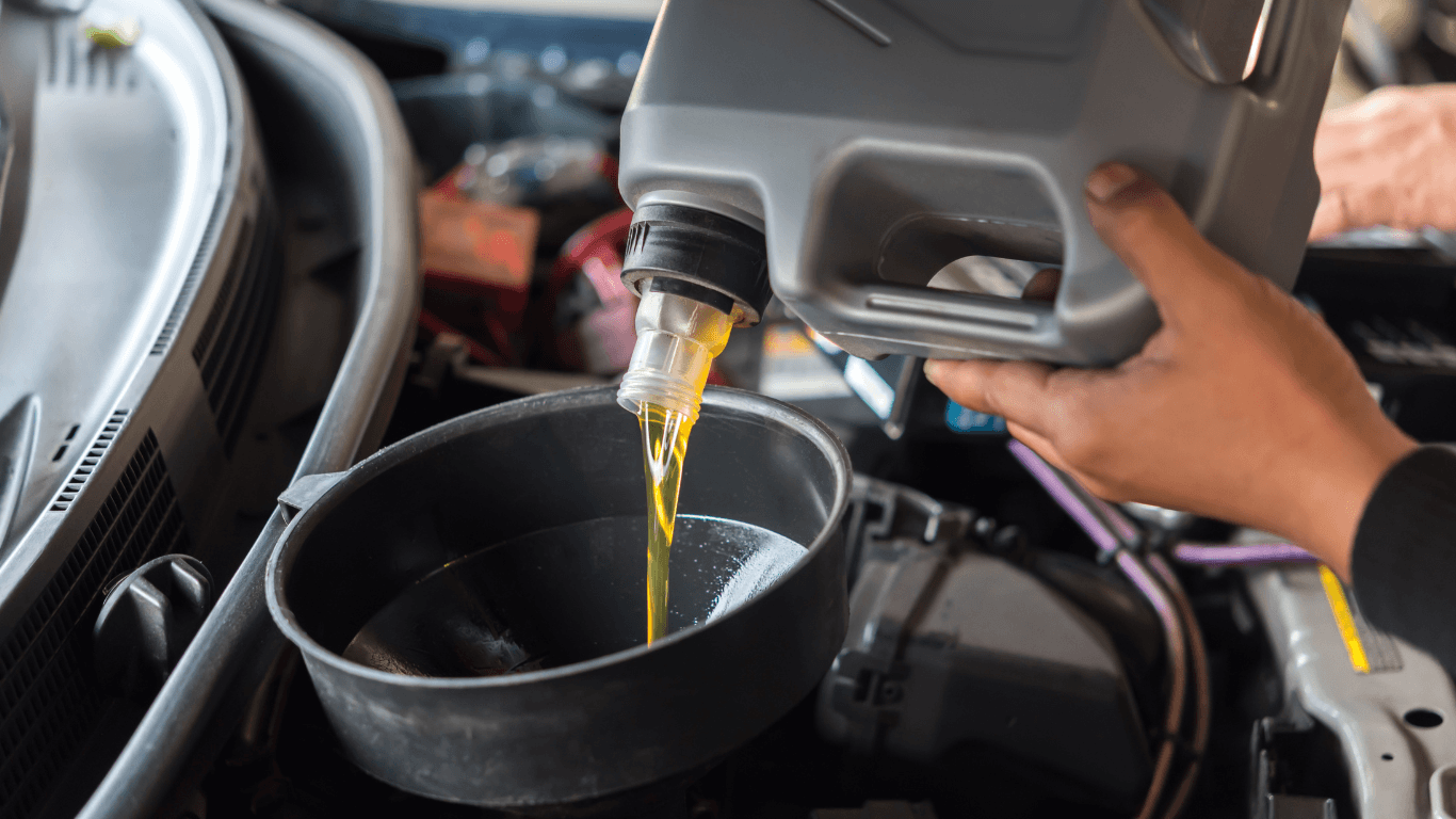 a mechanic doing an oil change
