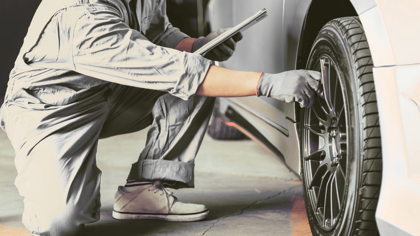 a mobile auto repair technician doing a pre purchase inspection