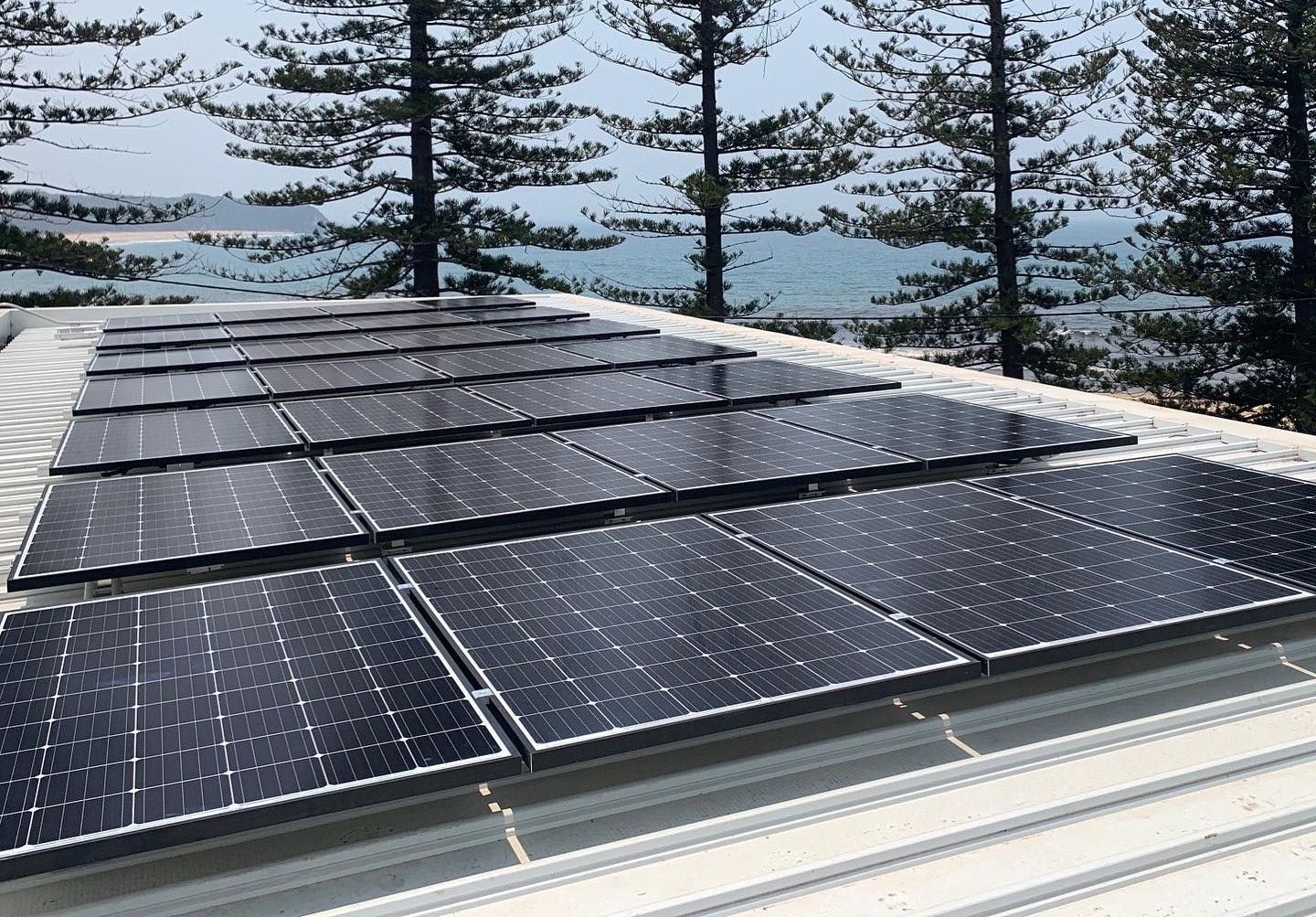 There Are Many Solar Panels On The Roof Of A House — Forster Solar and Lighting In Hallidays Point, NSW