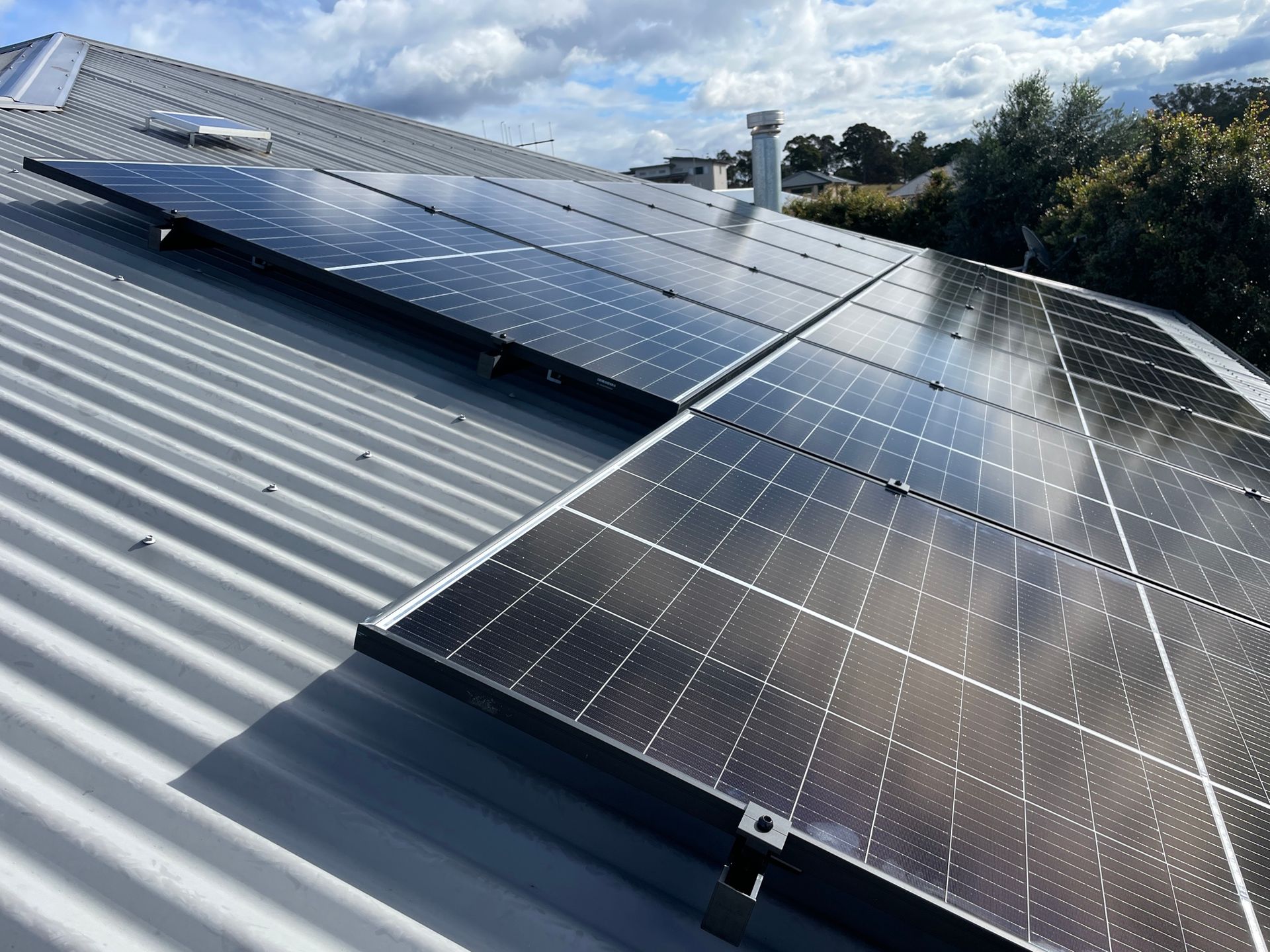 A Field Of Solar Panels And Wind Turbines — Forster Solar and Lighting In Nabiac, NSW