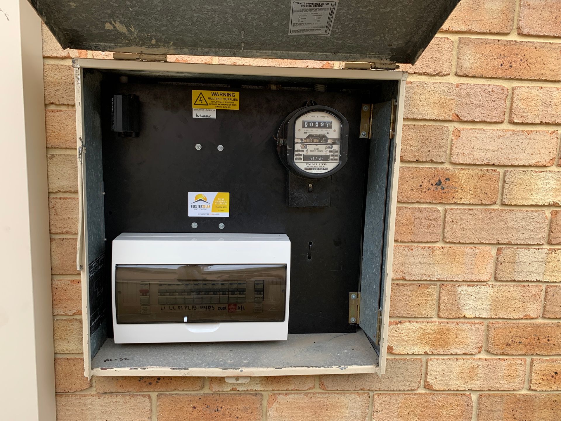 A Remote Control Is Sitting On Top Of A Solar Panel — Forster Solar and Lighting In Forster, NSW