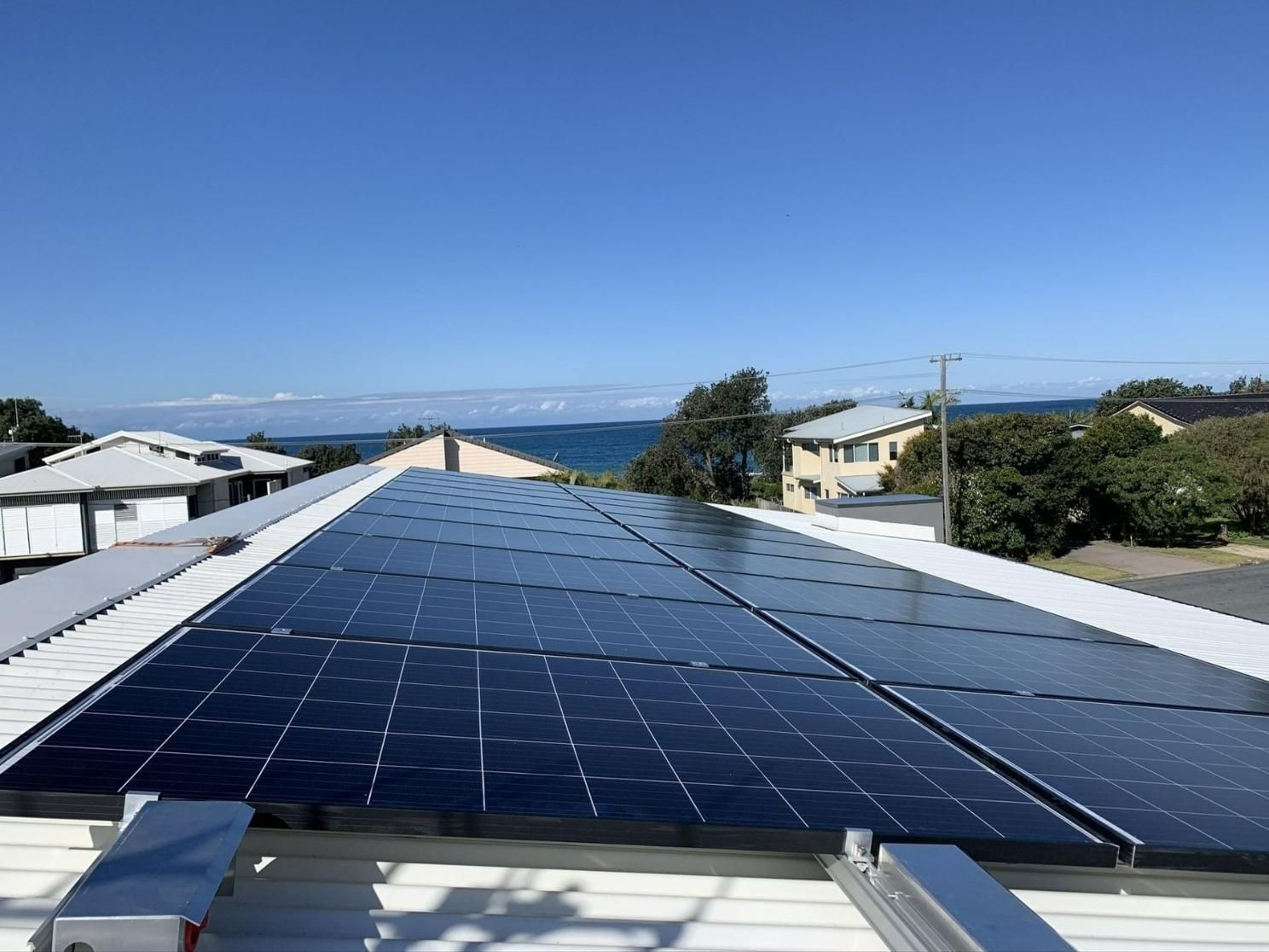 There Are Many Solar Panels On The Roof Of A House — Forster Solar and Lighting In Forster, NSW