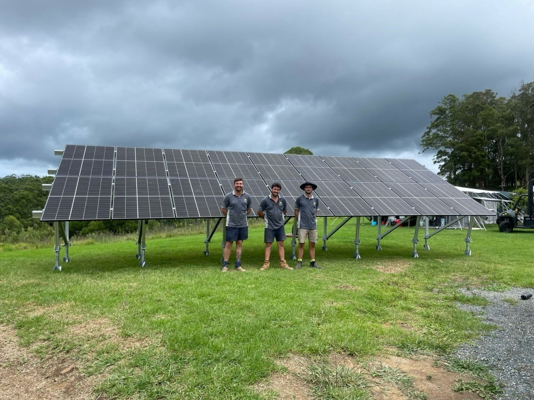 A Person Is Touching A Solar Panel With Their Finger — Forster Solar and Lighting In Pacific Palms, NSW
