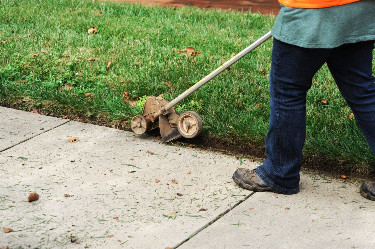 A Person Trimming the Grass — Banksia Turf In Wauchope, NSW