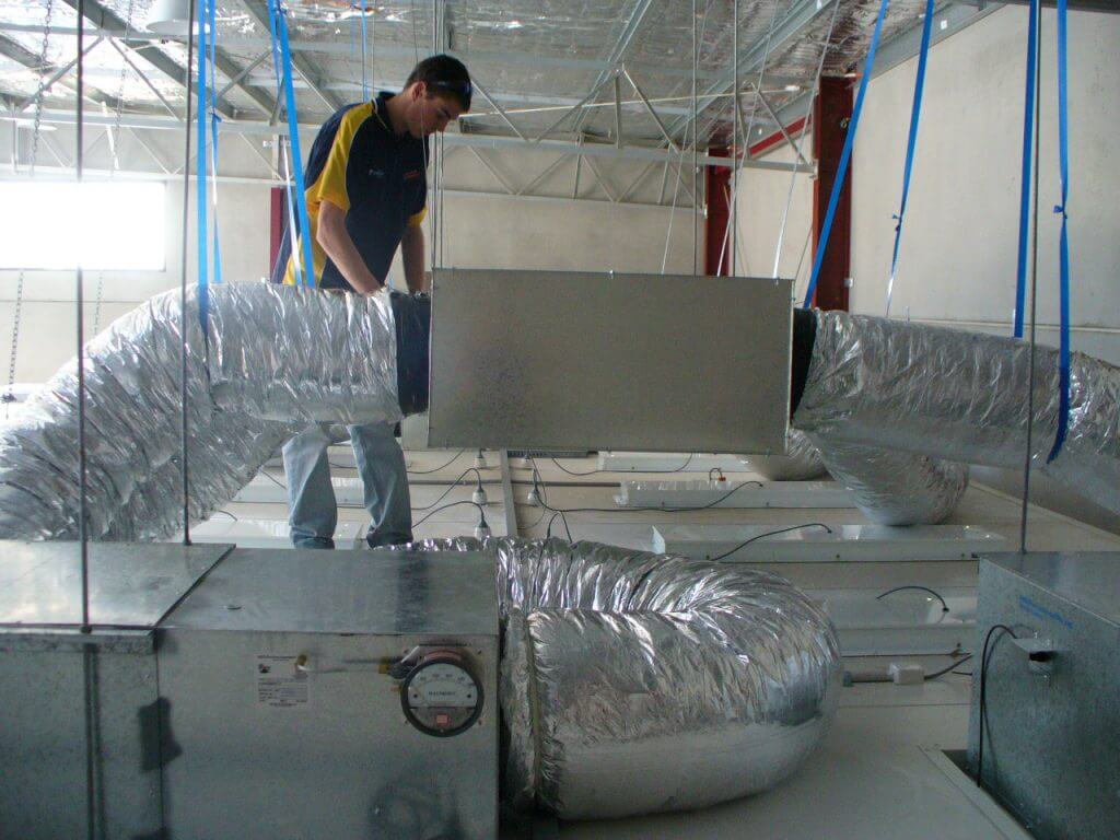 staff working on air con