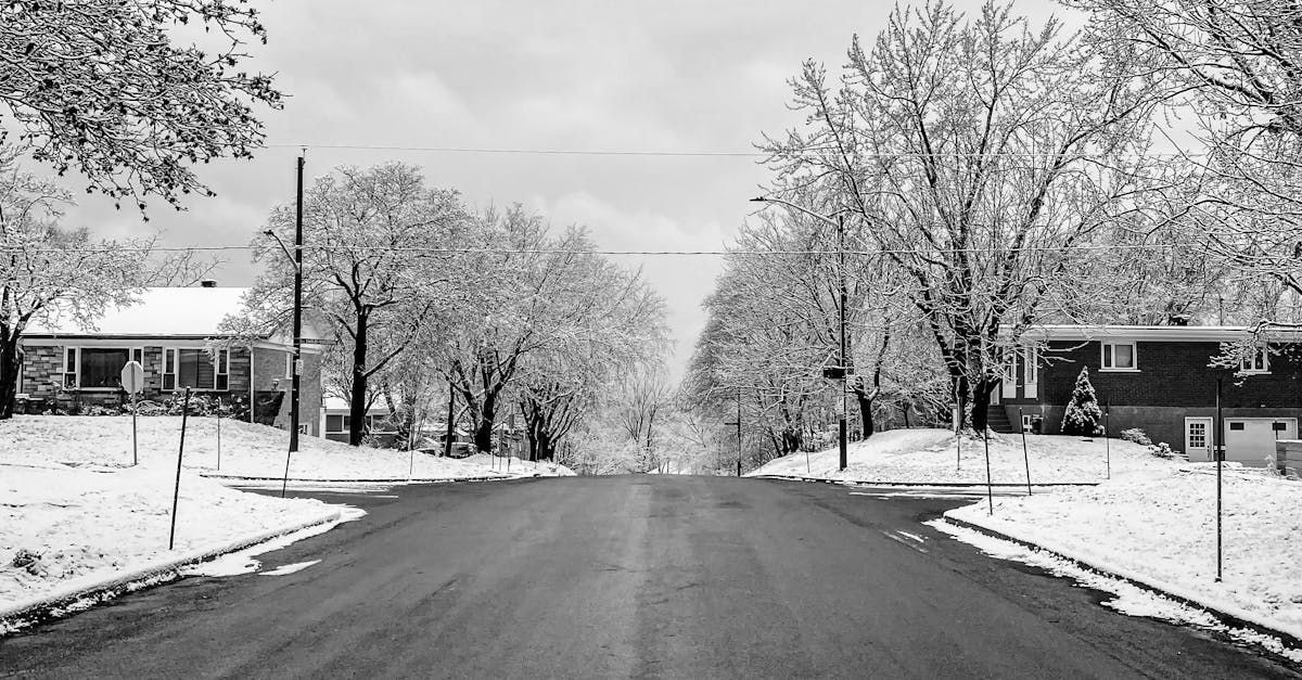 A black and white photo of a snowy street