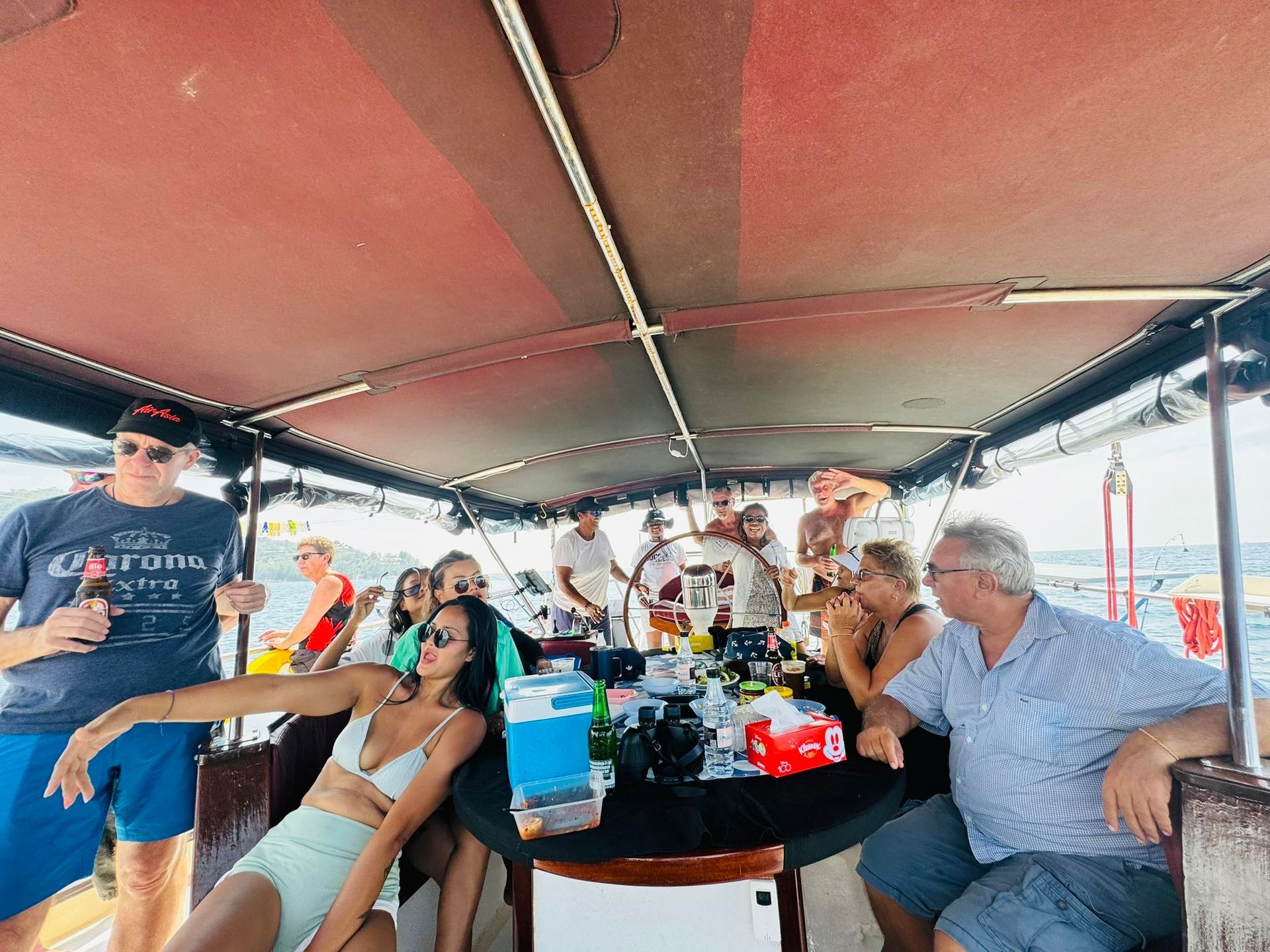 A group of people are sitting on a boat.