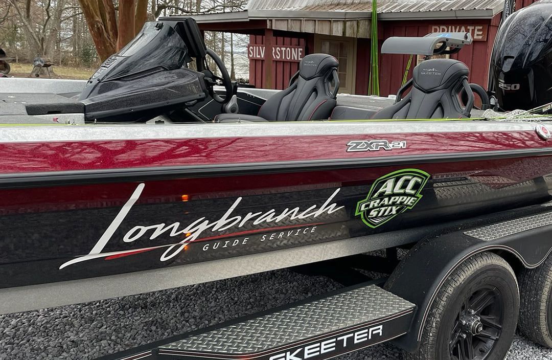 A maroon and black Skeeter bass boat with 