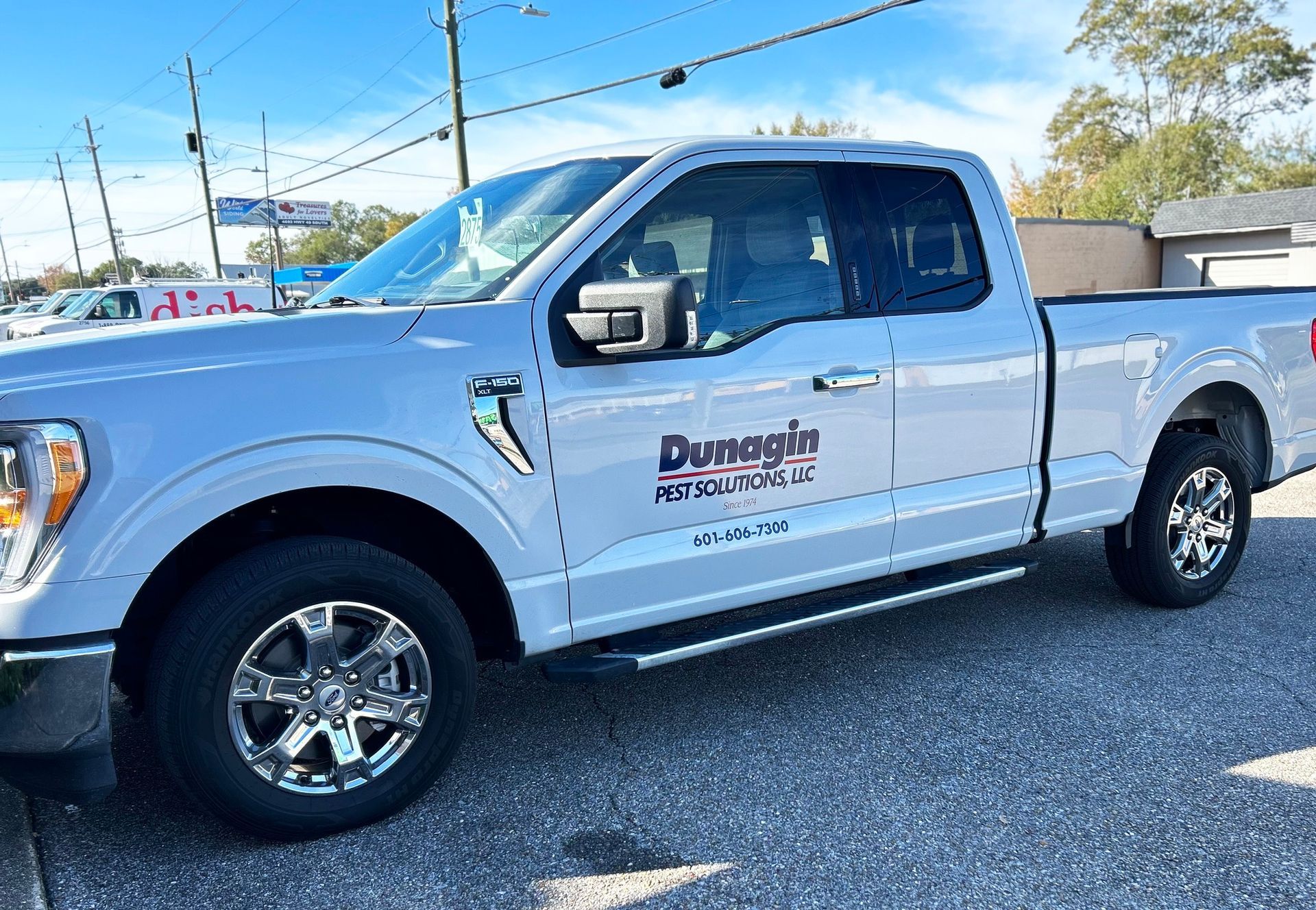 A white Ford F-150 pickup truck with 